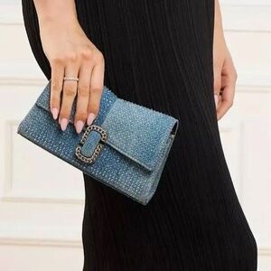 The Denim St. Marc Chain Wallet in Light Blue Crystal by
MARC JACOBS